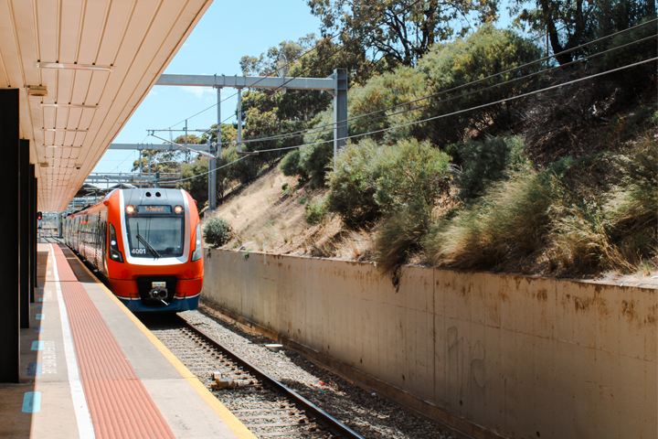 A train slowing stopping into Noarlunga Railway Station.
