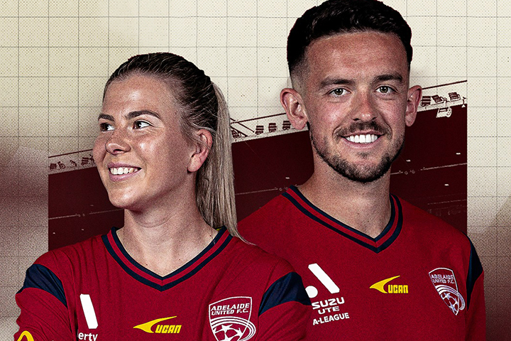 A male and a female stand back to back both wearing the Adelaide United FC jersey