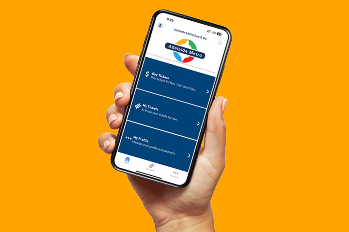 A hand holding a mobile phone with the Adelaide Metro Buy and Go app opened.