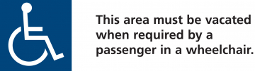 Blue and white international symbol for disability. Text within the image reads 'this area must be vacated when required by a passenger in a wheelchair'.