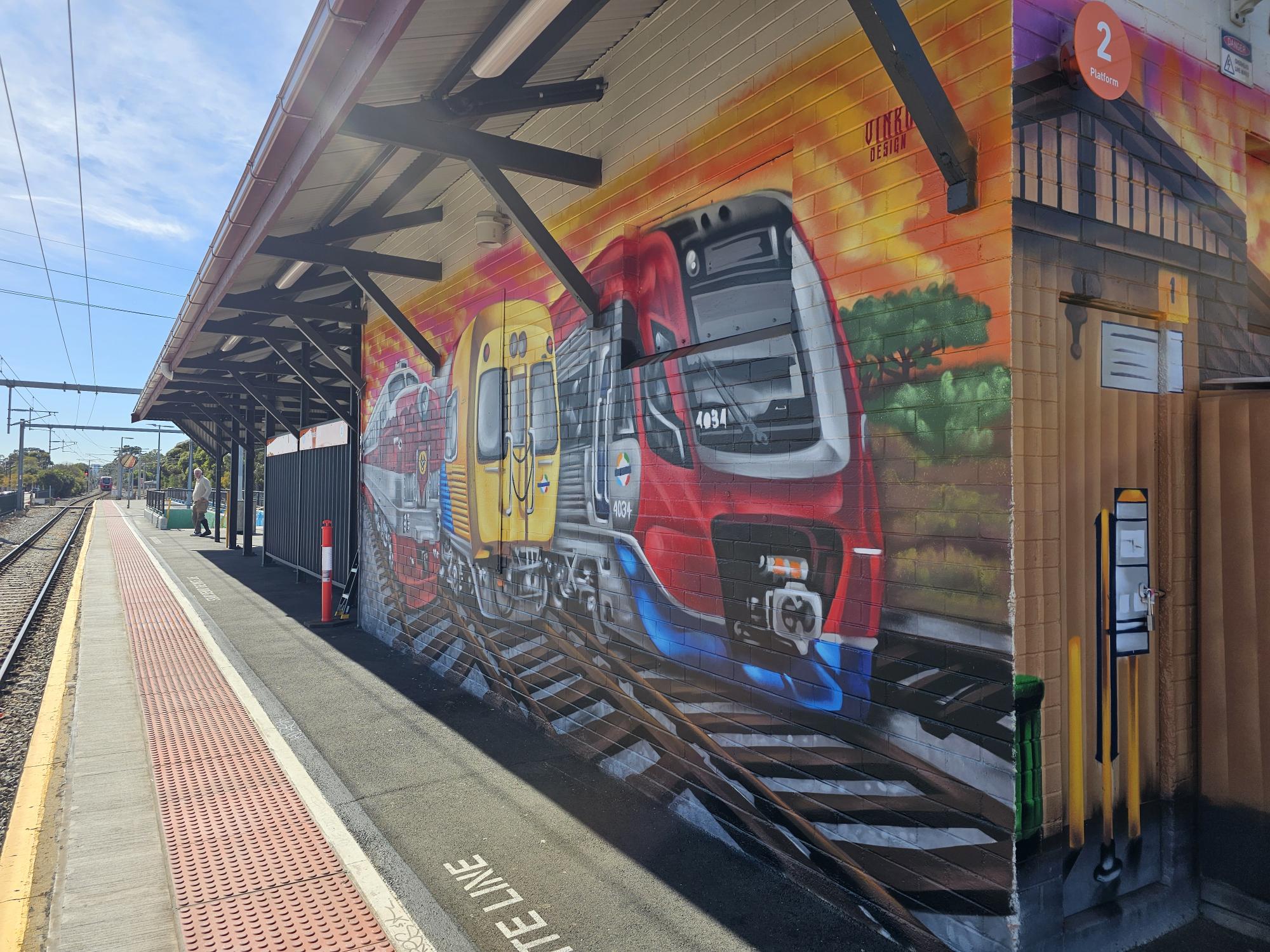 Train station with a street art mural