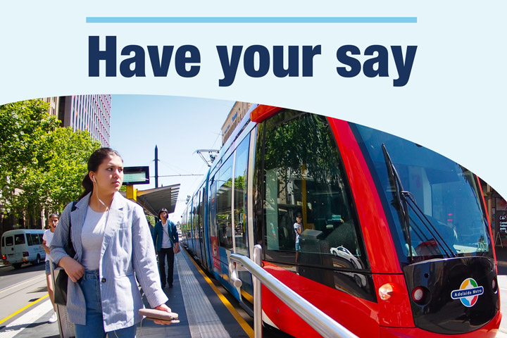 Woman near a tram with the text 'have your say'